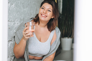 Young woman plus size in sport wear