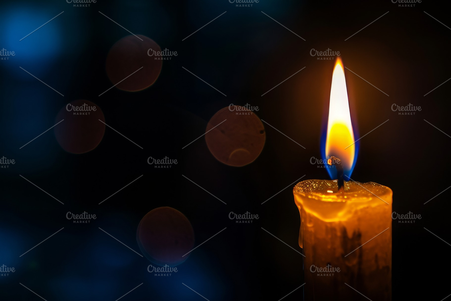 A lit candle stands prominent in the, a Photo by Iftikhar Alam