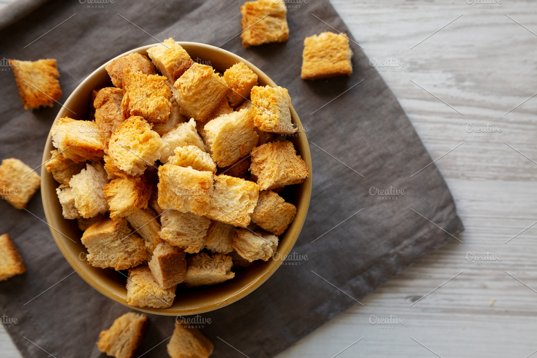 Homemade Crispy Bread Croutons in a Bowl, top view. Close-up., a Food & Drink Photo by LiudmylaChuhunova