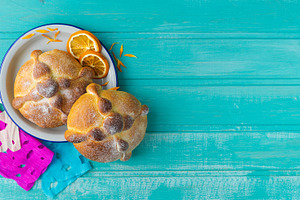 Pan de muerto on blue background.