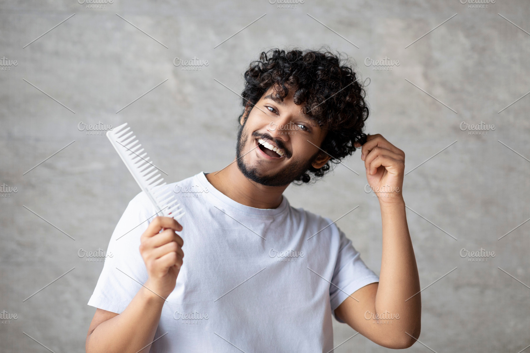 Home care after shower, morning routine procedure. Cheerful indian man with com, a Person Photo by Prostock-Studio