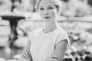 Elegant blonde woman posing outdoors with arms crossed, portrayi, a Person Photo by Studio ANNA
