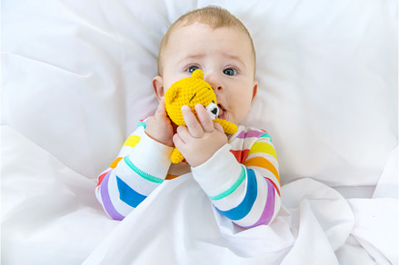 The baby in the crib goes to bed, a Person Photo by yanadjana