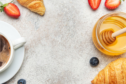 Continental breakfast composition with croissants, coffee, berri