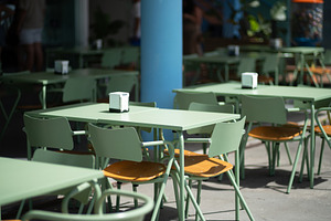 Sage Green Tables on a Cafe Terrace, a Food & Drink Photo by SkyNext