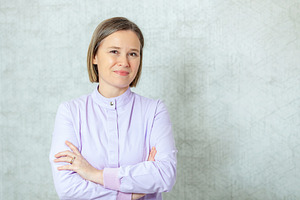 Confident doctor posing with arms crossed, looking at camera, a Health & Medical Photo by Antonio Gravante Market
