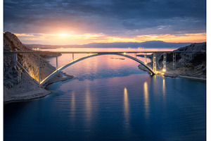 Bridge over the sea at sunset, an Architecture Photo by den-belitsky