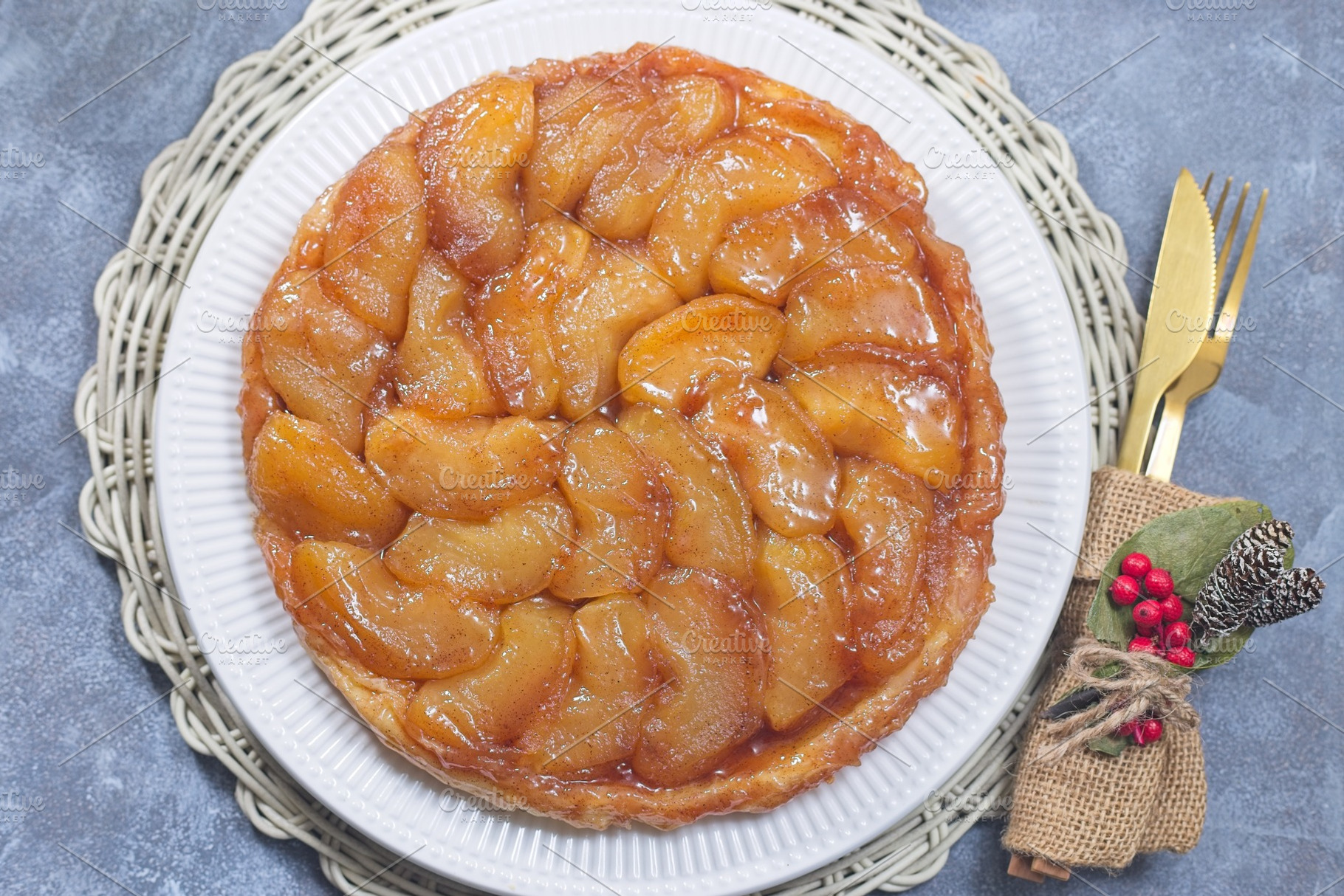 Apple Taret Tatin on plate, french upside down cake, horizontal top view, a Food & Drink Photo by iuliia_n