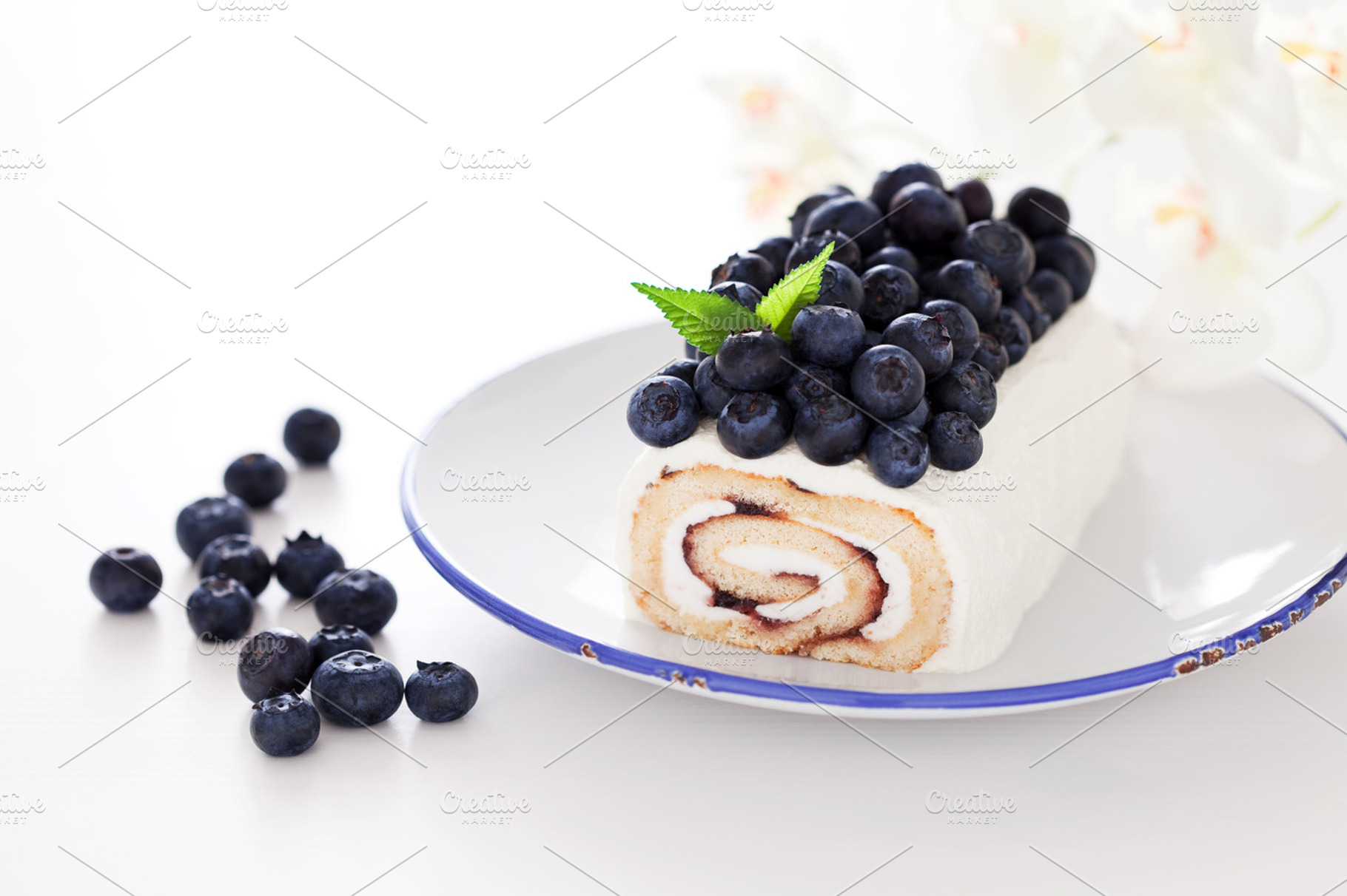 Cake roll featuring baked, blueberry, and cake