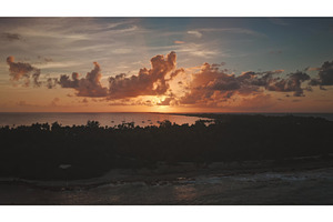 Sunset illuminating Rangiroa island, an Animal Photo by Goinyk