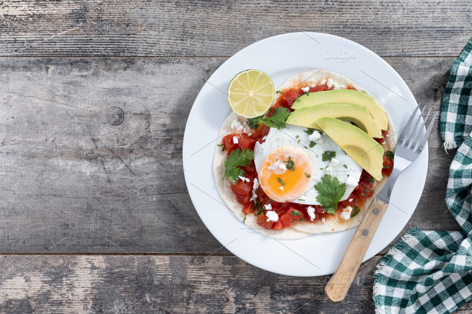 Huevos Rancheros on wooden table., a Food & Drink Photo by etorres69