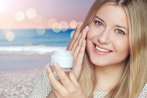 Young woman applying facial cream for skincare and beauty, prote, a Person Photo by Studio ANNA