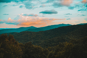 Western north carolina containing mountains, sunset, and golden hour