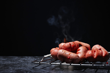 Concept of tasty food, grilled mini sausage, space for text, a Background Photo by AtlasStudio PRO