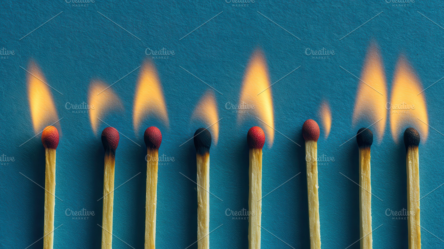 Burning matches against a blue, a Photo by Pavel_design