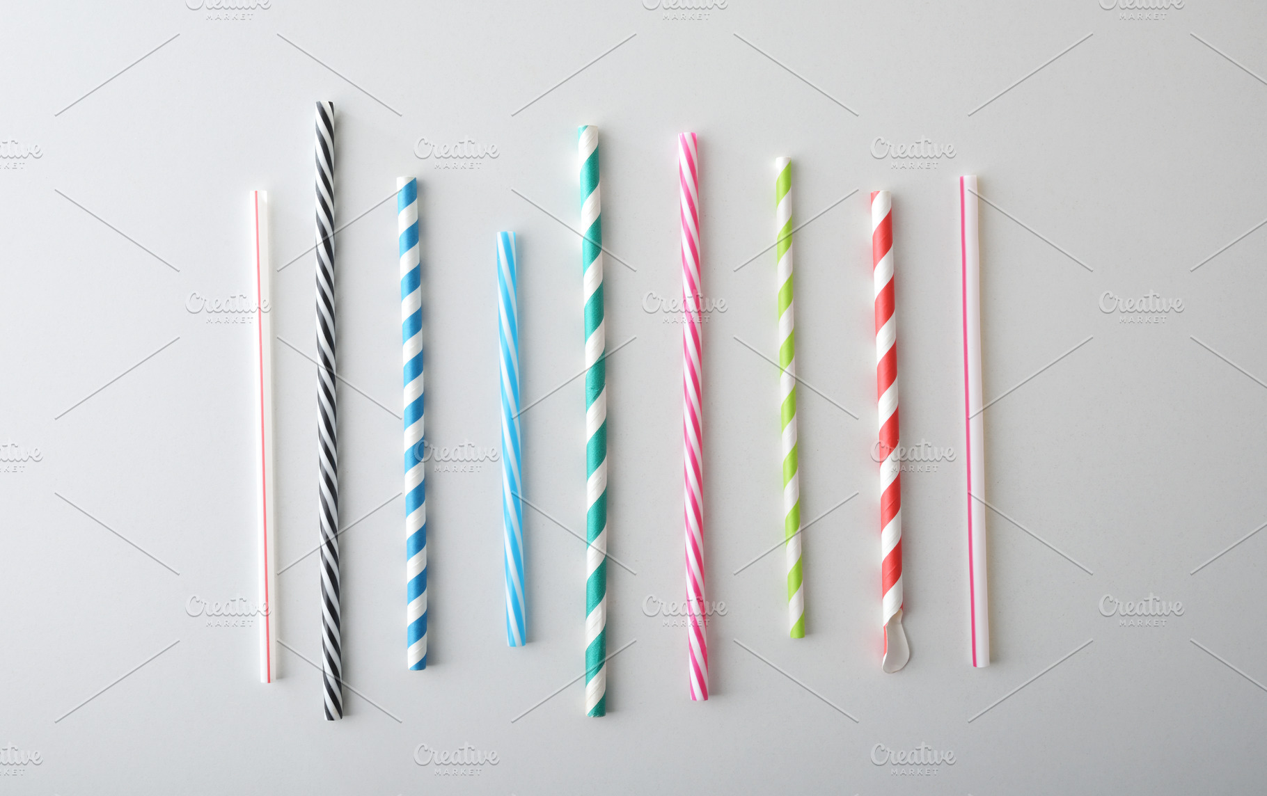 Collection of tubular drinking straws with different motifs and, a Food & Drink Photo by Davizro's Market