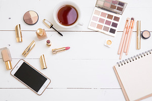 flat lay- desk with tea and cosmetic
