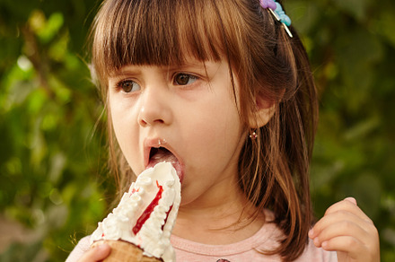 Cute Little girl eating delicious ice-cream in the city park on a summer sunny, a Person Photo by Rohan Photography