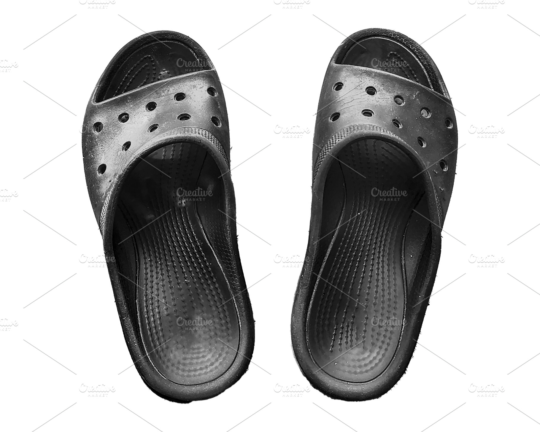 High angle view black sandals isolated photo, a Beauty & Fashion Photo by DanFLCreativo