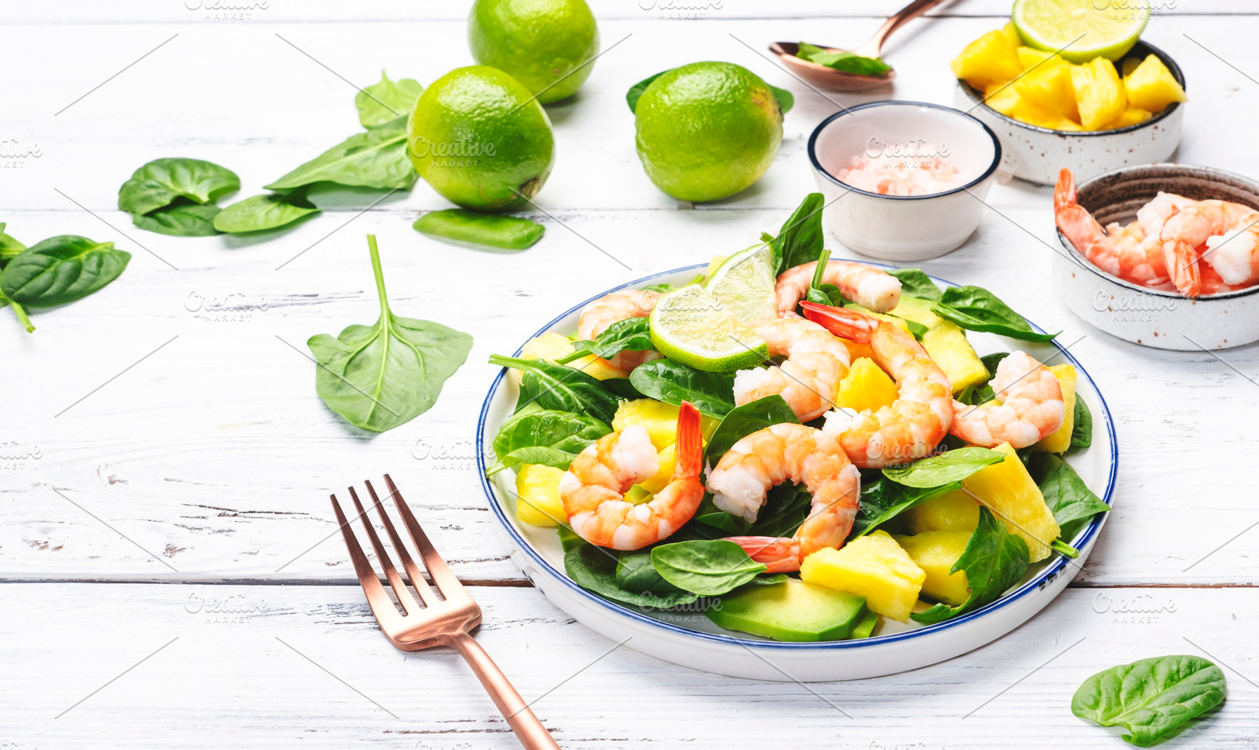Shrimp pineapple salad with spinach, avocado and lime on white w, a Food & Drink Photo by 5PH