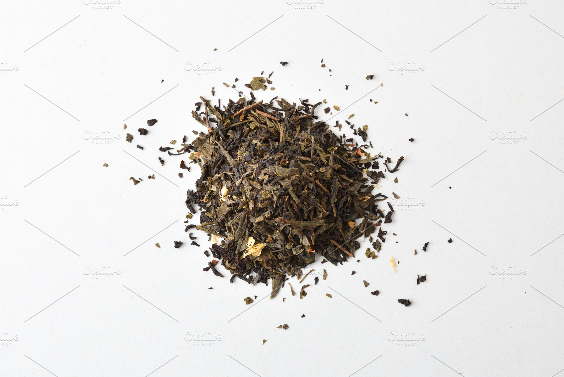 Pile of dried tea leaves white isolated background top view, a Food & Drink Photo by Davizro's Market
