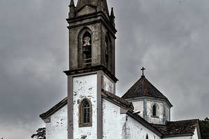 Old church with bell tower on a clou, an Architecture Photo by Perpis