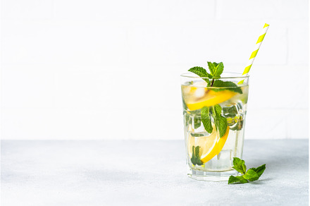 Lemonade in glass on white table., a Food & Drink Photo by Nadia-nb