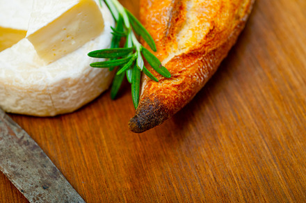 French cheese and fresh  baguette on a wood cutter, a Food & Drink Photo by keko64