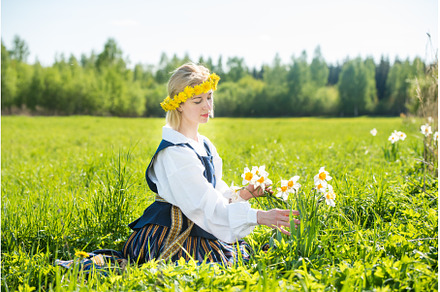 Young woman in national dress in a, a Nature Photo by COLORFUL