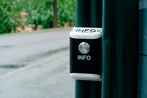 public information button beside an outdoor path