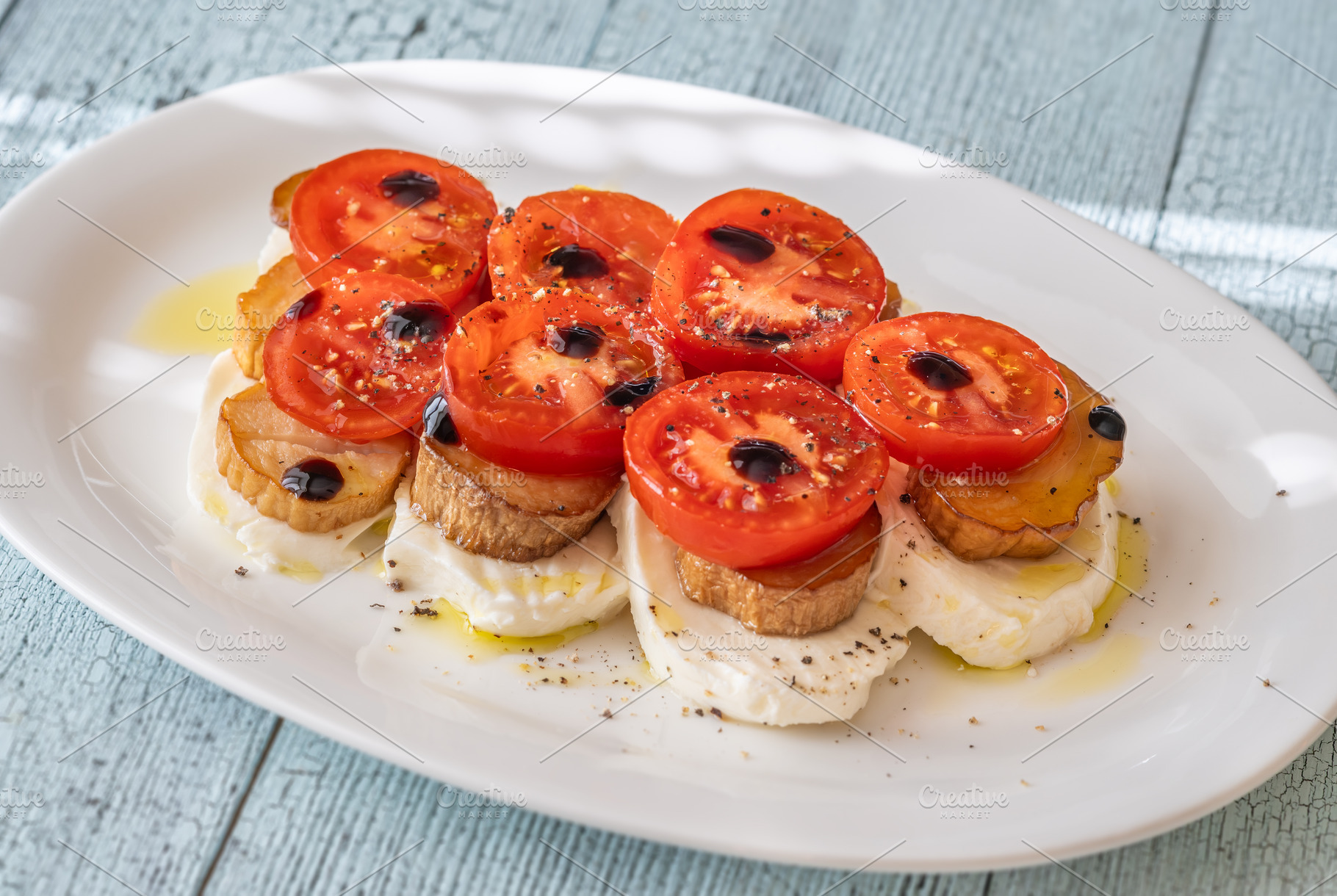 Elegant Caprese salad with mozzarella tomatoes king oyster mushr, a Food & Drink Photo by Alexander Prokopenko