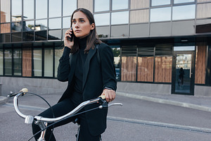 Businesswoman making a phone call, a Business Photo by Artem Varnitsin