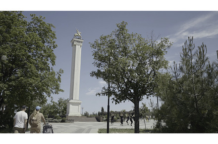 Tourists walk in city park with, an Architecture Photo by Media Whale Stock