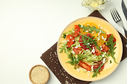 Concept of tasty food, salad with red orange, space for text, a Food & Drink Photo by AtlasStudio