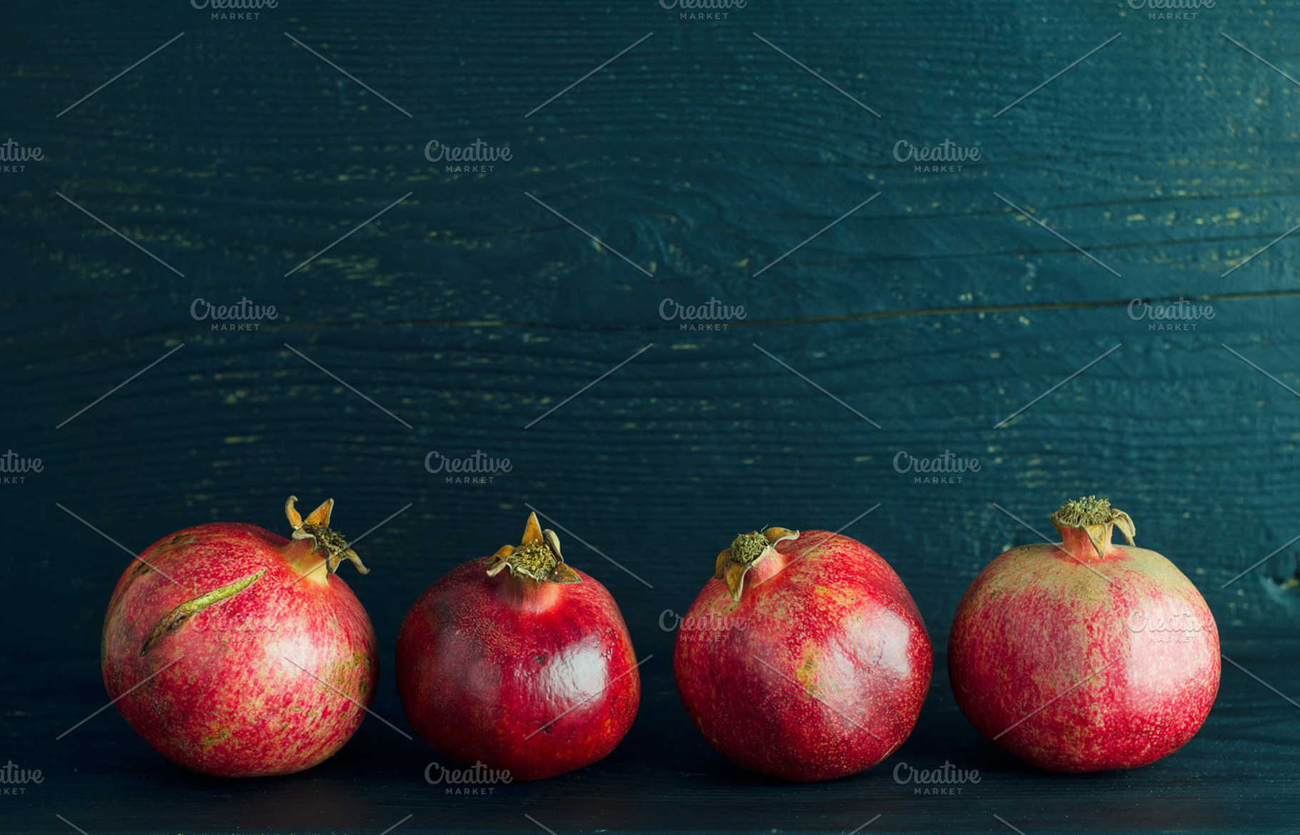 Pomegranates containing pomegranate, fruit, and red, a Food & Drink Photo by bogdandimages
