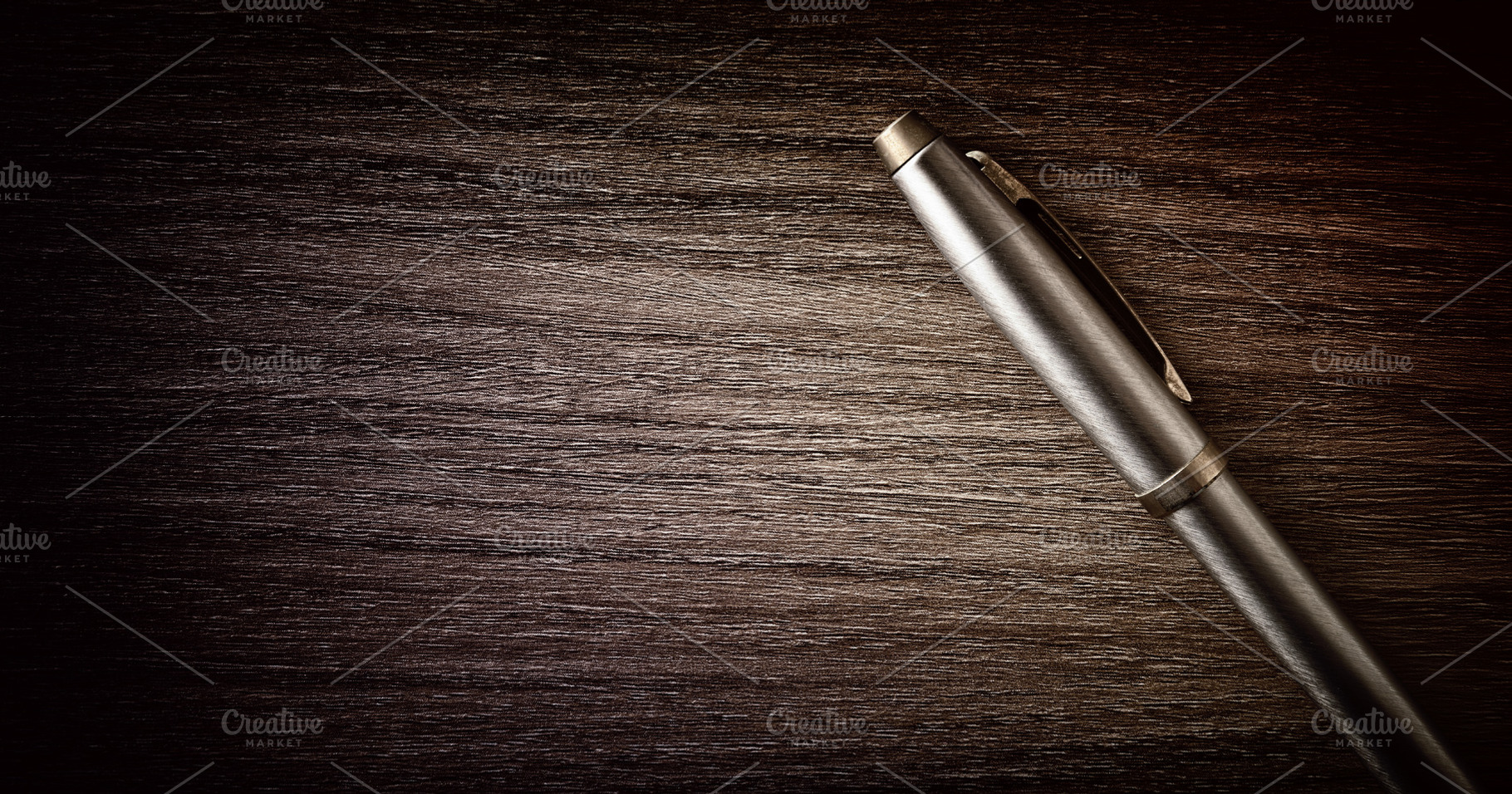 Metal Pen on Dark Wooden Desk, a Business Photo by Davizro's Market