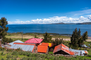 Scenic view of Lake Titicaca from Llachon with rural houses, an Architecture Photo by GoodGoods