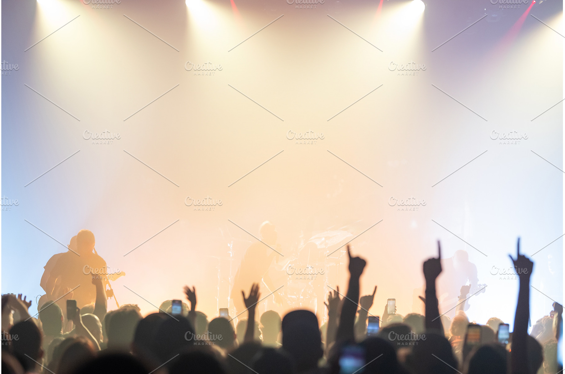Crowd raising hands under bright, a Person Photo by Barcelona_dreams