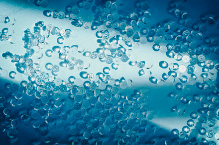 Texture image of many diamonds in blue water illuminated by sunl, a Photo by NanihtaCreative