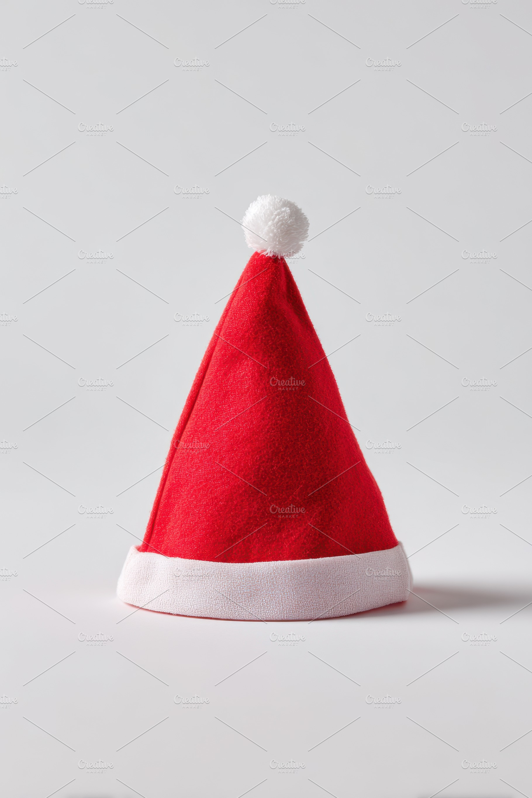Red Santa hat for festive celebrations, a Holiday Photo by AlyaAnd