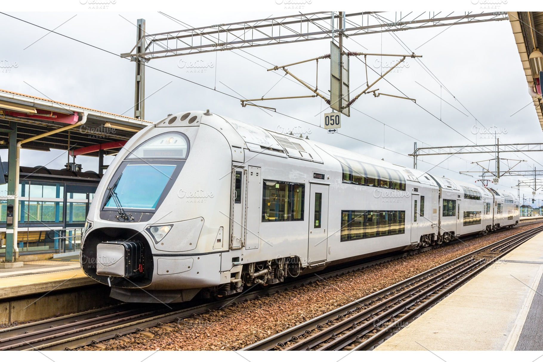 Modern double-decker train in Sodertalje syd station - Sweden, a Transportation Photo by Leonid Andronov