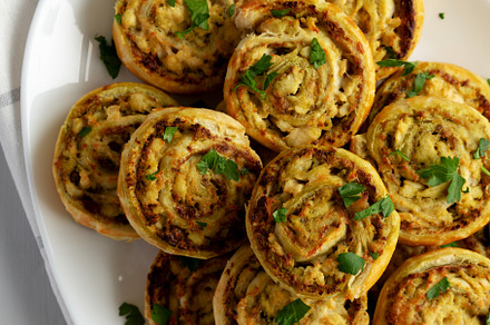 Homemade Chicken Pesto Pinwheels on a Plate, top view. Flat lay,, a Food & Drink Photo by LiudmylaChuhunova