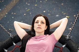 Close-up overhead portrait of a woman with her hands behind her, a Person Photo by Imaginarium