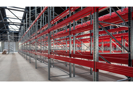 Warehouse with empty high pallet, an Industrial Photo by Jan Jack Russo Media