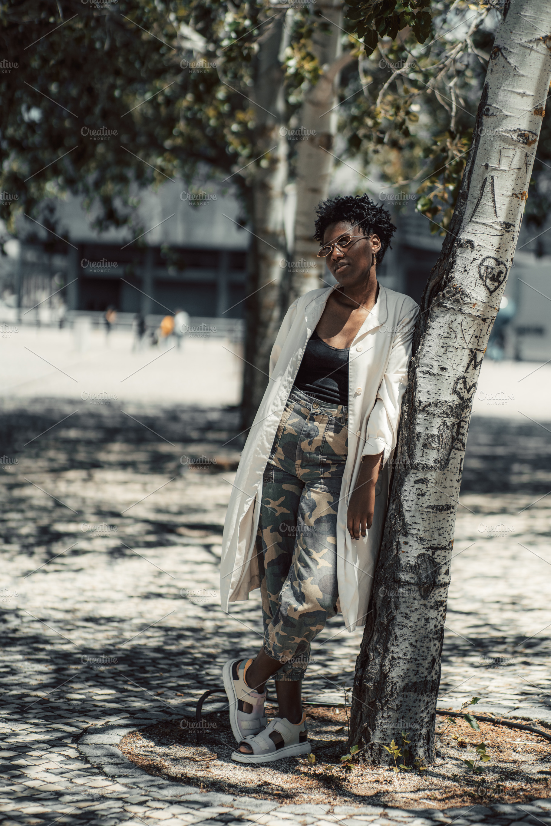Woman Leaning by Urban Tree, a Person Photo by SkyNext