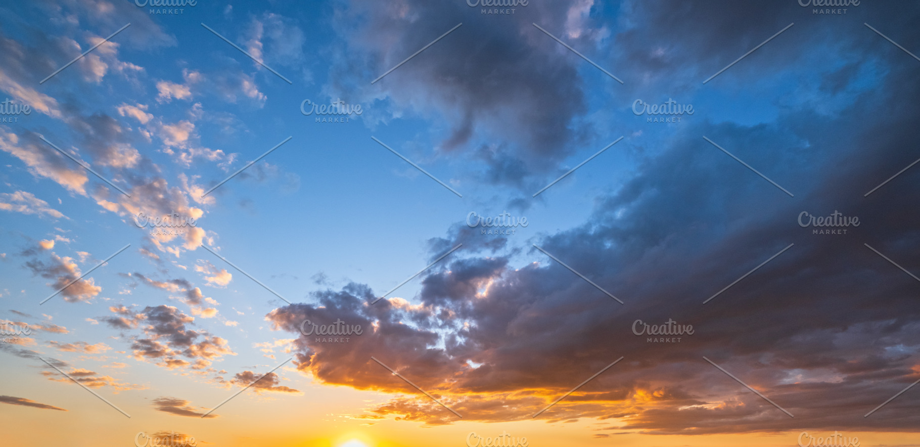 Clouds in evening dusk sky panoramic view. Climate, environment, a Nature Photo by YuriyB