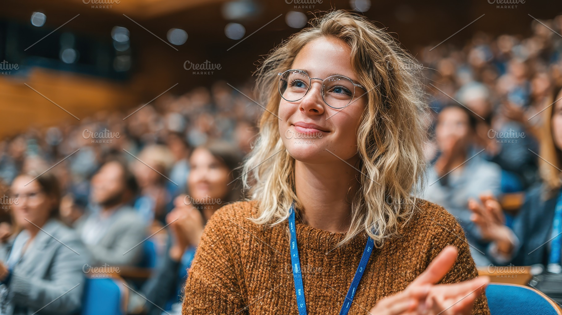 Young woman smiling at conference ap, a Photo by Pixeness Studio