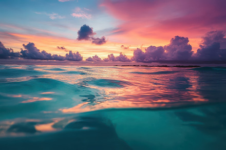 Vibrant sunset over the tranquil oce, a Photo by Tanuart