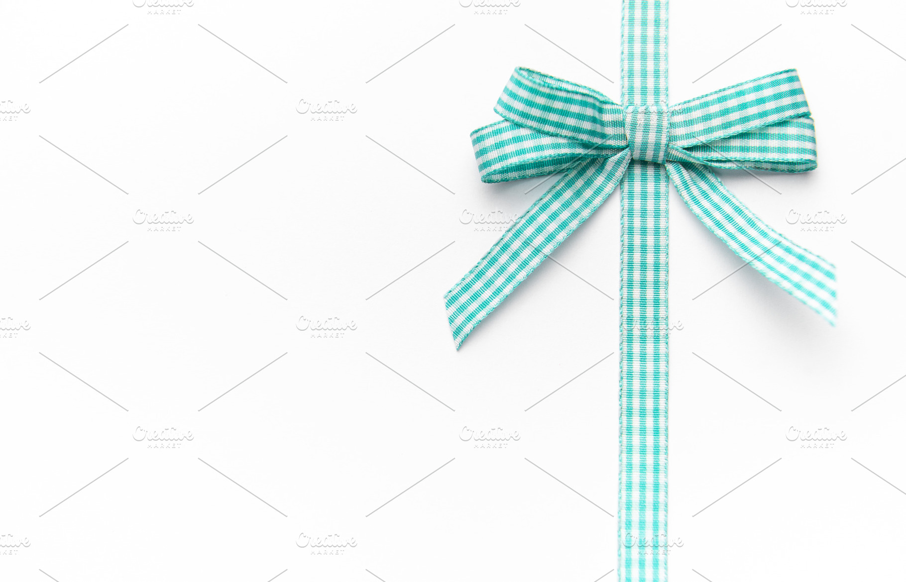 Gingham ribbon bow with copy space, a Holiday Photo by Olena Rudo