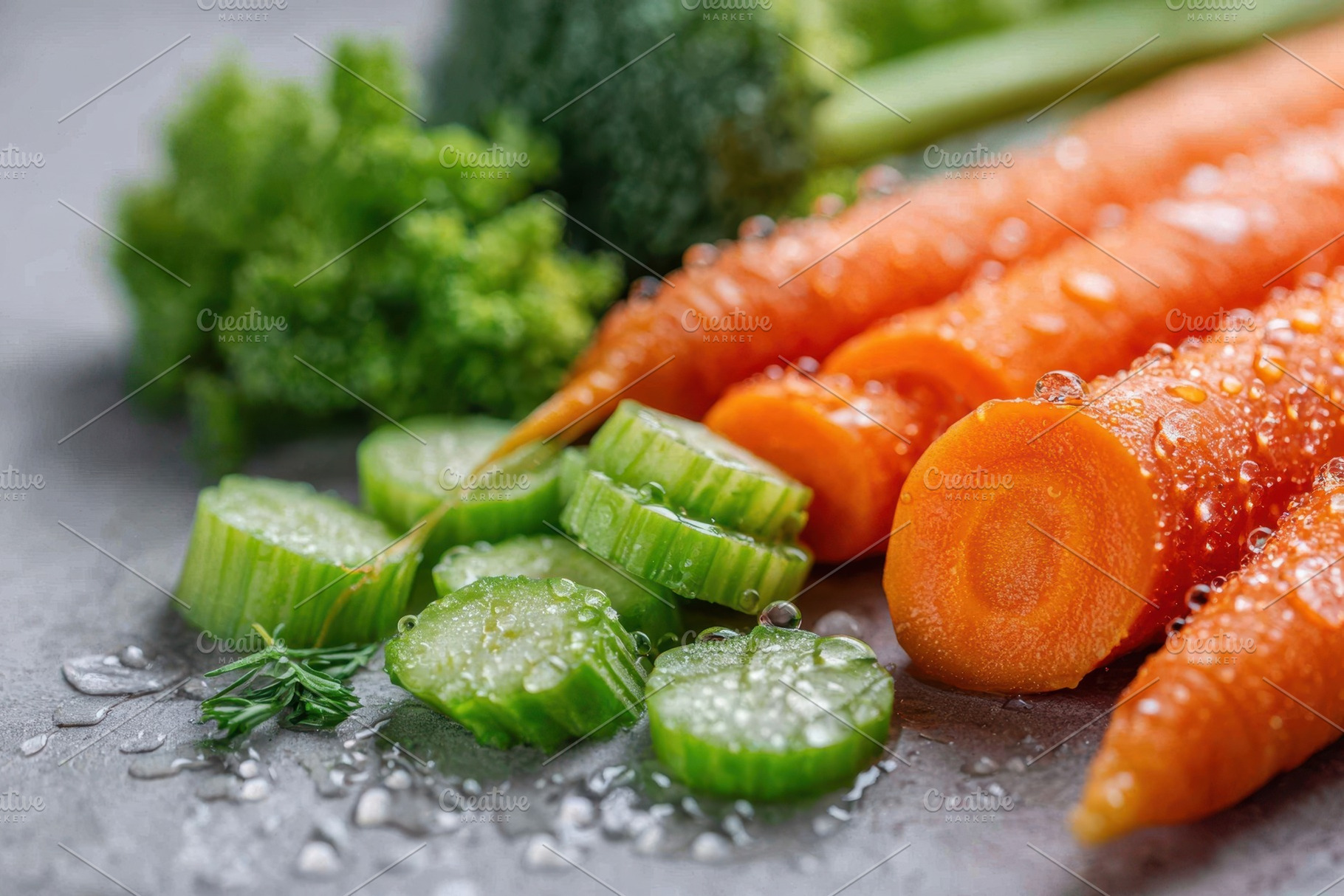 Fresh carrots and cucumber slices with water droplets, a Food & Drink Photo by AlyaAnd
